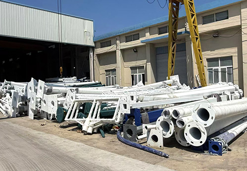 (Finished Product Zone) : Systematic staging of fully coated and protected poles, ready for secure global container loading.