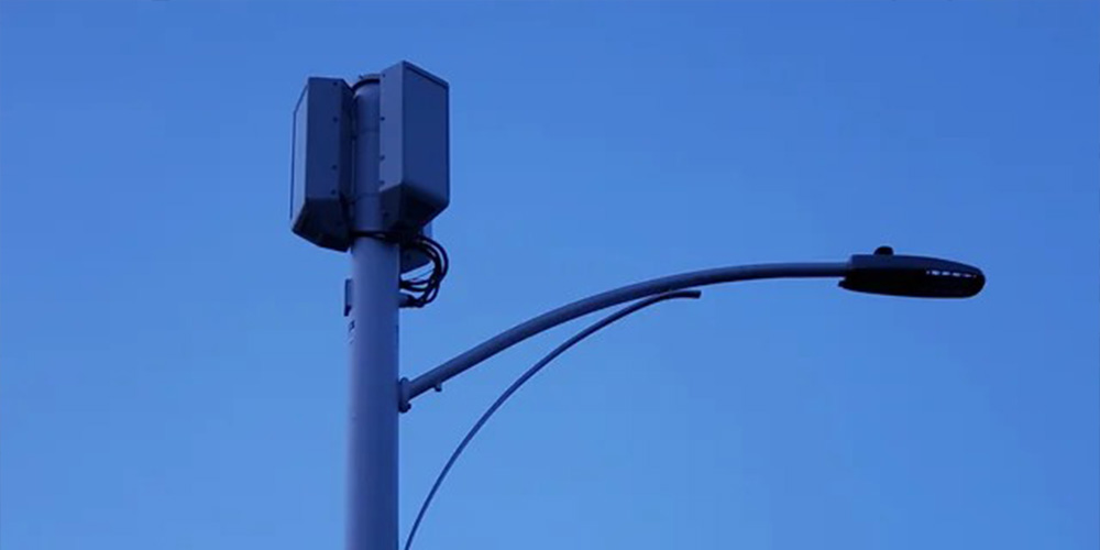Multifunction smart street light pole with surveillance camera and wireless connectivity system