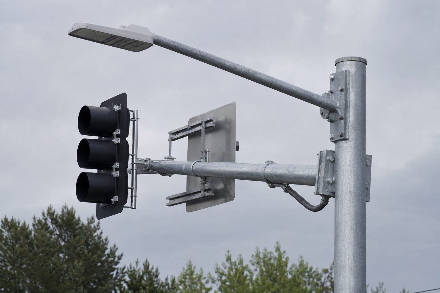 Traffic signal mast arm pole showing coordinated signal heads signs and street light placement